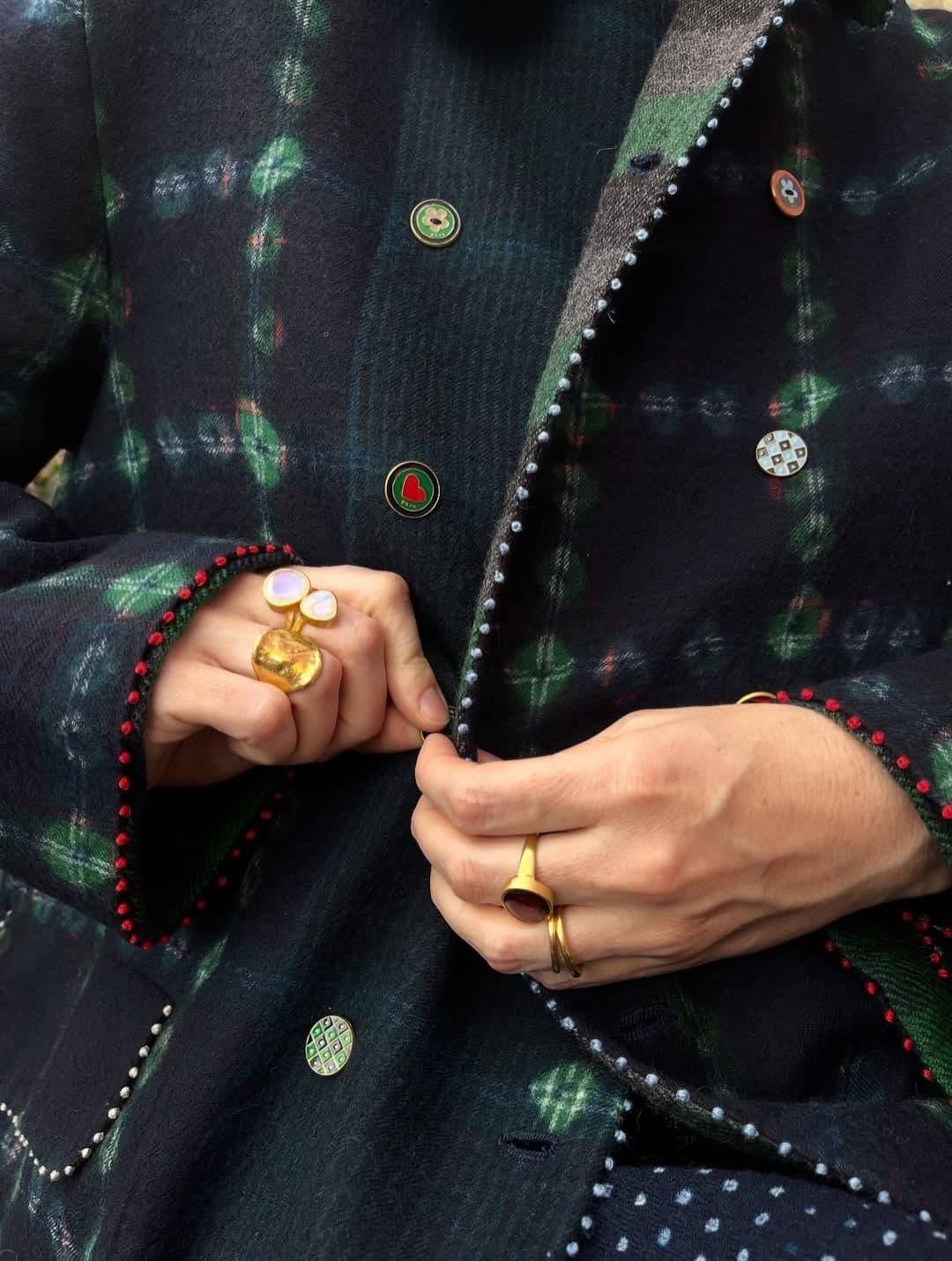 Tailored textile detail and jewelry from a Periferi editorial look