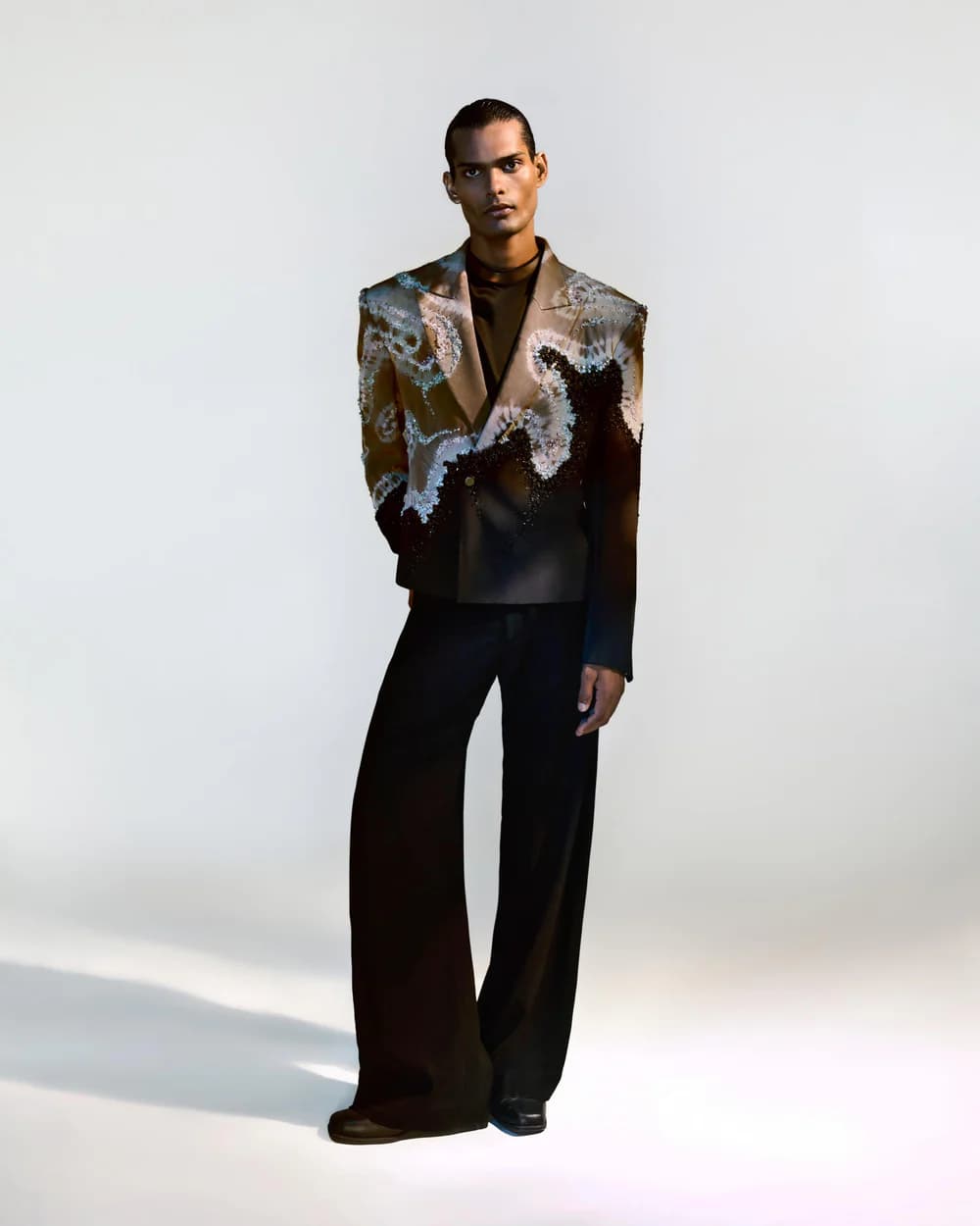 BLONI studio portrait in embellished tailoring